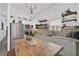 Bright kitchen features white shaker cabinets, marble countertops, and a farmhouse sink at 27000 Harrison Rd, Sidell, FL 34266