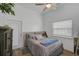 Spacious bedroom with a queen bed, and access to private patio at 27000 Harrison Rd, Sidell, FL 34266