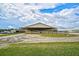 Covered equestrian barn and riding arena at 27000 Harrison Rd, Sidell, FL 34266