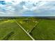 Wide shot of expansive property with pastures at 27000 Harrison Rd, Sidell, FL 34266