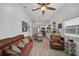 Bright living room with a fireplace and comfortable seating at 27000 Harrison Rd, Sidell, FL 34266