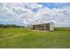 Convenient storage shed with covered stalls for equipment at 27000 Harrison Rd, Sidell, FL 34266