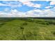 Aerial view of expansive property and pond at 27000 Harrison Rd, Sidell, FL 34266