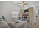 Serene bedroom with a queen bed, plenty of closet space and a TV at 27000 Harrison Rd, Sidell, FL 34266