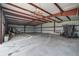 Large indoor arena with high ceilings and a concrete floor at 27000 Harrison Rd, Sidell, FL 34266