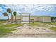 Tan metal building with double doors for equipment storage at 27000 Harrison Rd, Sidell, FL 34266