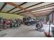 Spacious workshop with airboat, tools, and ample storage at 27000 Harrison Rd, Sidell, FL 34266