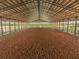 Covered riding arena with sandy surface at 27000 Harrison Rd, Sidell, FL 34266