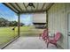 Relaxing screened porch overlooking a sprawling pasture at 27000 Harrison Rd, Sidell, FL 34266
