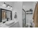 Stylish bathroom with a floating vanity, subway tile shower, and modern fixtures at 27000 Harrison Rd, Sidell, FL 34266