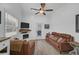 Cozy living room with a fireplace and leather couches at 27000 Harrison Rd, Sidell, FL 34266