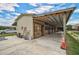 Covered stalls and tack room with convenient access at 27000 Harrison Rd, Sidell, FL 34266