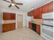 Efficient kitchen featuring wood cabinets and appliances at 1020 Roberta St, Venice, FL 34285