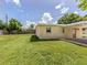 Large backyard with grassy area and fenced perimeter at 1020 Roberta St, Venice, FL 34285