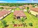 Aerial view of house with backyard and landscaping at 12261 Canavese Ln, Venice, FL 34293