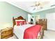 Spacious bedroom with a ceiling fan and en-suite bathroom at 12261 Canavese Ln, Venice, FL 34293