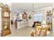 Kitchen with light wood cabinets and breakfast bar at 12261 Canavese Ln, Venice, FL 34293