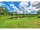 Serene backyard view overlooking a peaceful pond at 12261 Canavese Ln, Venice, FL 34293