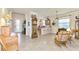Open living area with views to kitchen and entryway at 12261 Canavese Ln, Venice, FL 34293