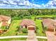 Single-story home with tile roof and landscaped yard at 12261 Canavese Ln, Venice, FL 34293