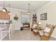 Cozy breakfast nook with seating for two and large window at 12261 Canavese Ln, Venice, FL 34293