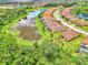 Aerial view of houses and lakefront community at 12261 Canavese Ln, Venice, FL 34293