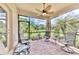 Relaxing screened porch with patio furniture and tranquil view at 12261 Canavese Ln, Venice, FL 34293