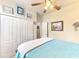 Bedroom with teal bedding and built in closet at 12261 Canavese Ln, Venice, FL 34293