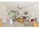 Spacious living room with ample seating and access to a patio at 12261 Canavese Ln, Venice, FL 34293