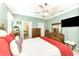 Comfortable bedroom with a large bed, dresser and en-suite bathroom at 12261 Canavese Ln, Venice, FL 34293