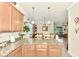 Modern kitchen with granite countertops, island, and breakfast area at 12261 Canavese Ln, Venice, FL 34293