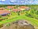 Aerial view of homes with lake access at 12261 Canavese Ln, Venice, FL 34293