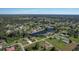Aerial view of homes and canal in a residential area at 12004 Sarto Ln, North Port, FL 34287