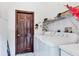 Laundry room with washer, dryer, and shelving at 12004 Sarto Ln, North Port, FL 34287