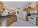 Spacious kitchen boasts granite countertops and ample wood cabinetry at 12004 Sarto Ln, North Port, FL 34287