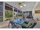 Sunroom with table and chairs, offering a view of the canal at 12004 Sarto Ln, North Port, FL 34287