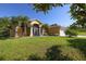 Single-story house with palm trees and a large front yard at 12004 Sarto Ln, North Port, FL 34287