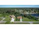 Two houses near a canal with lush greenery at 12004 Sarto Ln, North Port, FL 34287