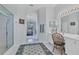 Elegant bathroom with double vanity, walk-in shower, and separate tub at 12004 Sarto Ln, North Port, FL 34287