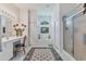 Bright bathroom featuring a double vanity, soaking tub, and walk-in shower at 12004 Sarto Ln, North Port, FL 34287
