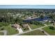 Two houses near a canal with lush greenery at 12004 Sarto Ln, North Port, FL 34287
