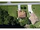 Aerial view showing house, landscaping, and canal-side location at 12004 Sarto Ln, North Port, FL 34287