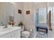 Bathroom with a shower/tub combo and white vanity at 12004 Sarto Ln, North Port, FL 34287