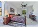 Main bedroom with a large bed and wood furniture at 12004 Sarto Ln, North Port, FL 34287