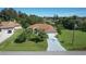 House with driveway and two car garage, nicely landscaped yard at 12004 Sarto Ln, North Port, FL 34287
