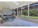 Spacious sunroom with ample seating and large windows overlooking the garden at 12004 Sarto Ln, North Port, FL 34287