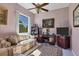 Home office featuring a comfortable couch and wood desk at 12004 Sarto Ln, North Port, FL 34287
