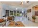 Bright sunroom, perfect for relaxing or dining, with view of the backyard at 12004 Sarto Ln, North Port, FL 34287