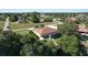 Aerial view of a single-Gathering home with a backyard and a canal at 12004 Sarto Ln, North Port, FL 34287