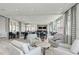 Stylish common area featuring comfortable seating, tables, and large windows for natural lighting at 12000 Tapestry Ln, Venice, FL 34293